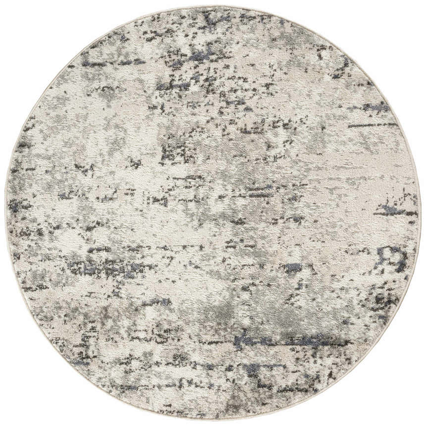 Close-up of round Nourison Quarry Ivory Blue Grey rug with a distressed, abstract pattern. High pile texture.