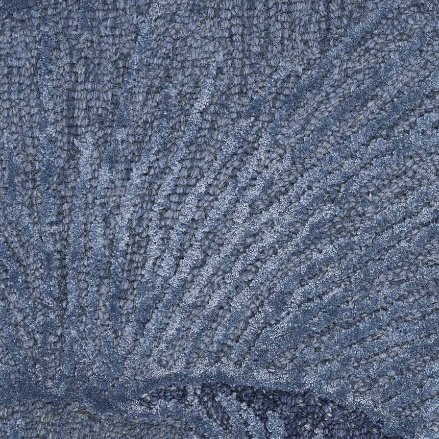 Close-up of the light blue Nourison Avra rug, showing the wool texture and mid-century modern pattern.