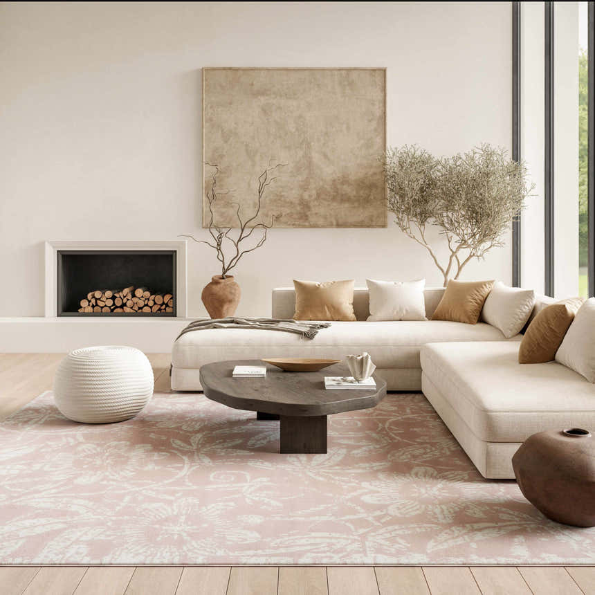 Living room with a sectional sofa and Nourison Whimsicle Pink Farmhouse Indoor Area Rug.