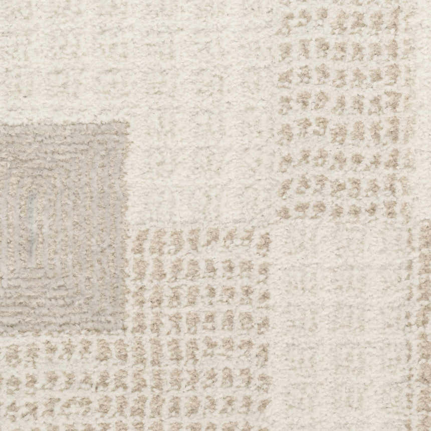 Close-up of the Nourison Nordic Ivory Beige Rug, showing its textured pile and subtle chestnut geometric pattern.