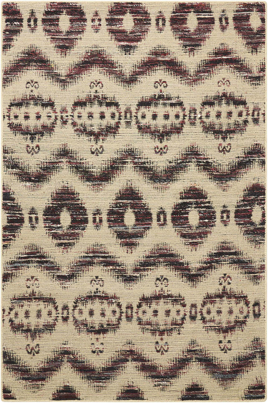 Close-up of the Nourison Spectrum Beige Black rug showing its ikat-inspired geometric pattern and woven texture.