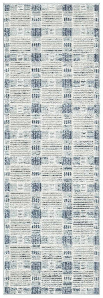 Close-up of the Nourison Nordic Blue rug. Light blue, gray, and white geometric pattern. Modern style.