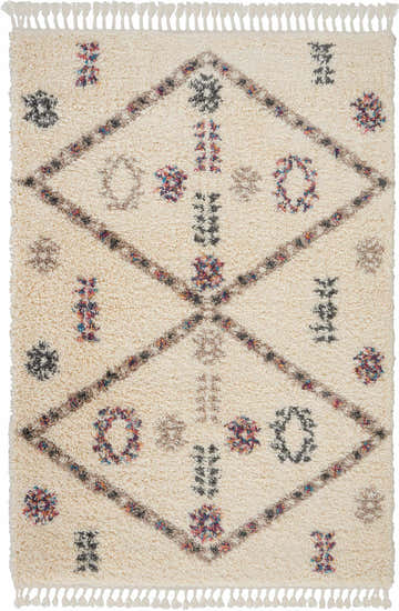 Close-up of Nourison Denmark Shag Ivory rug featuring diamond pattern, tassels, and colorful accents. Scandinavian style.