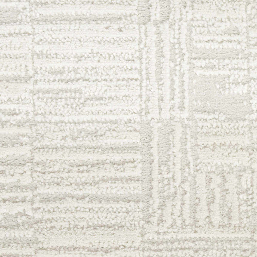 Close-up of the Nourison Dew Beige Rug, showcasing its low pile texture and subtle geometric pattern.