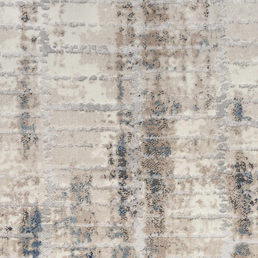 Close-up of Calvin Klein CK022 Infinity rug. Ivory, grey, blue, and chestnut abstract pattern. Modern, machine-made texture.