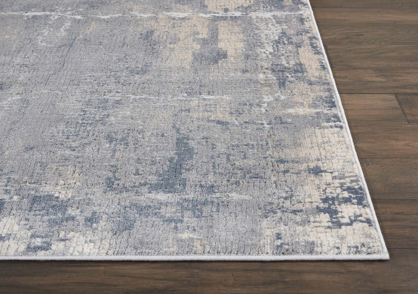 Close up of the grey beige Nourison Rustic Textures area rug showing the modern abstract pattern and soft texture.