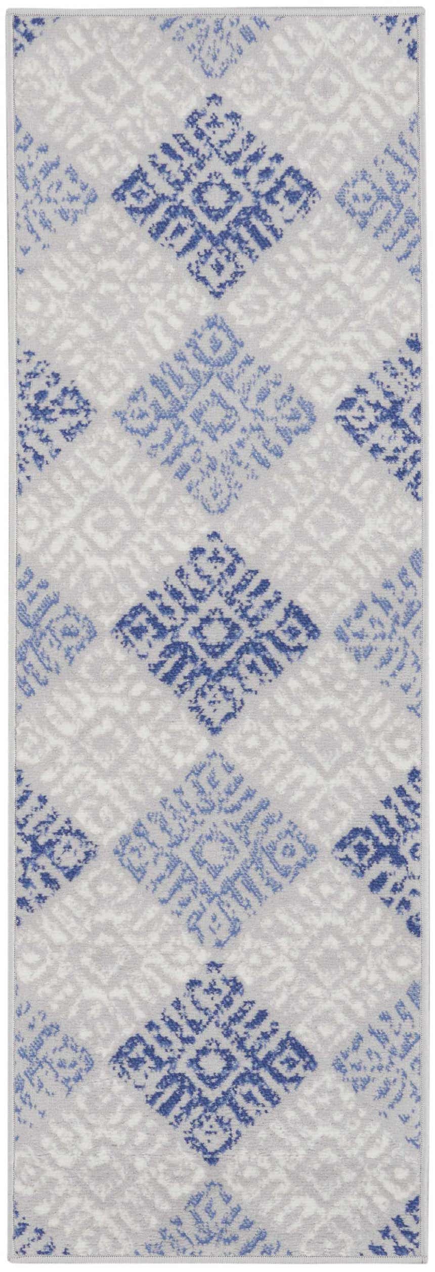 Close-up of the Nourison Whimsicle Grey Blue Bohemian Indoor Area Rug featuring a geometric diamond pattern.