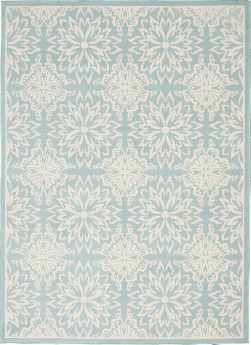 Close-up of the Nourison Jubilant Ivory Green rug, showcasing its floral farmhouse pattern and soft texture.