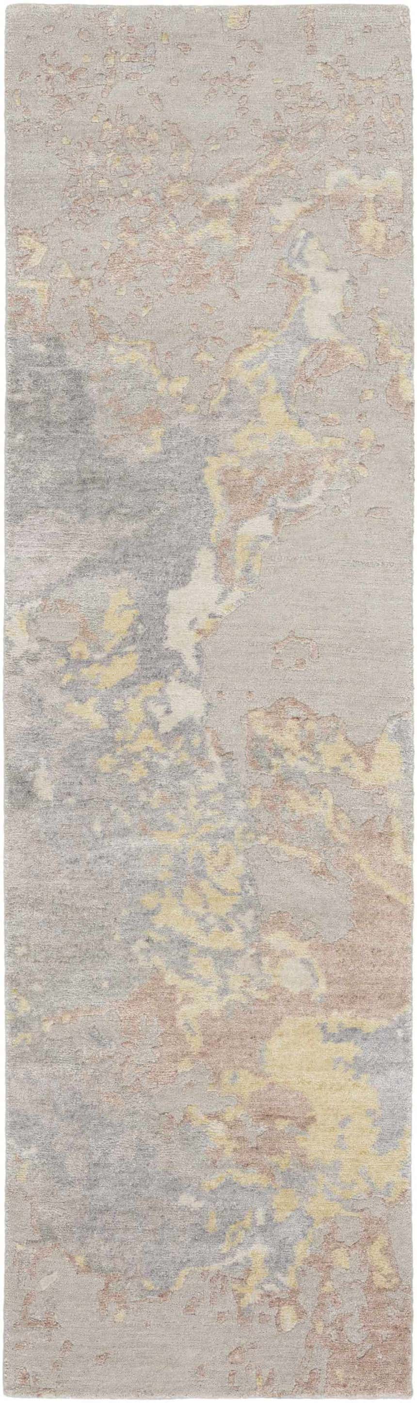 Close-up of Nourison Silk Shadows Silver rug. Abstract design with gray, beige, and yellow tones. Soft, silk-like texture.