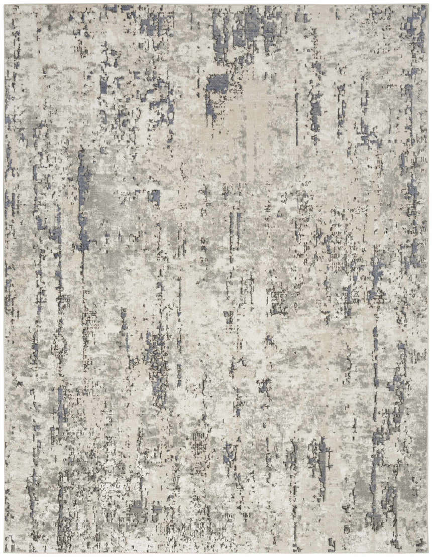 Close-up of the Nourison Quarry Ivory Blue Grey Rug. Abstract design with chestnut, ivory, blue, and grey tones.
