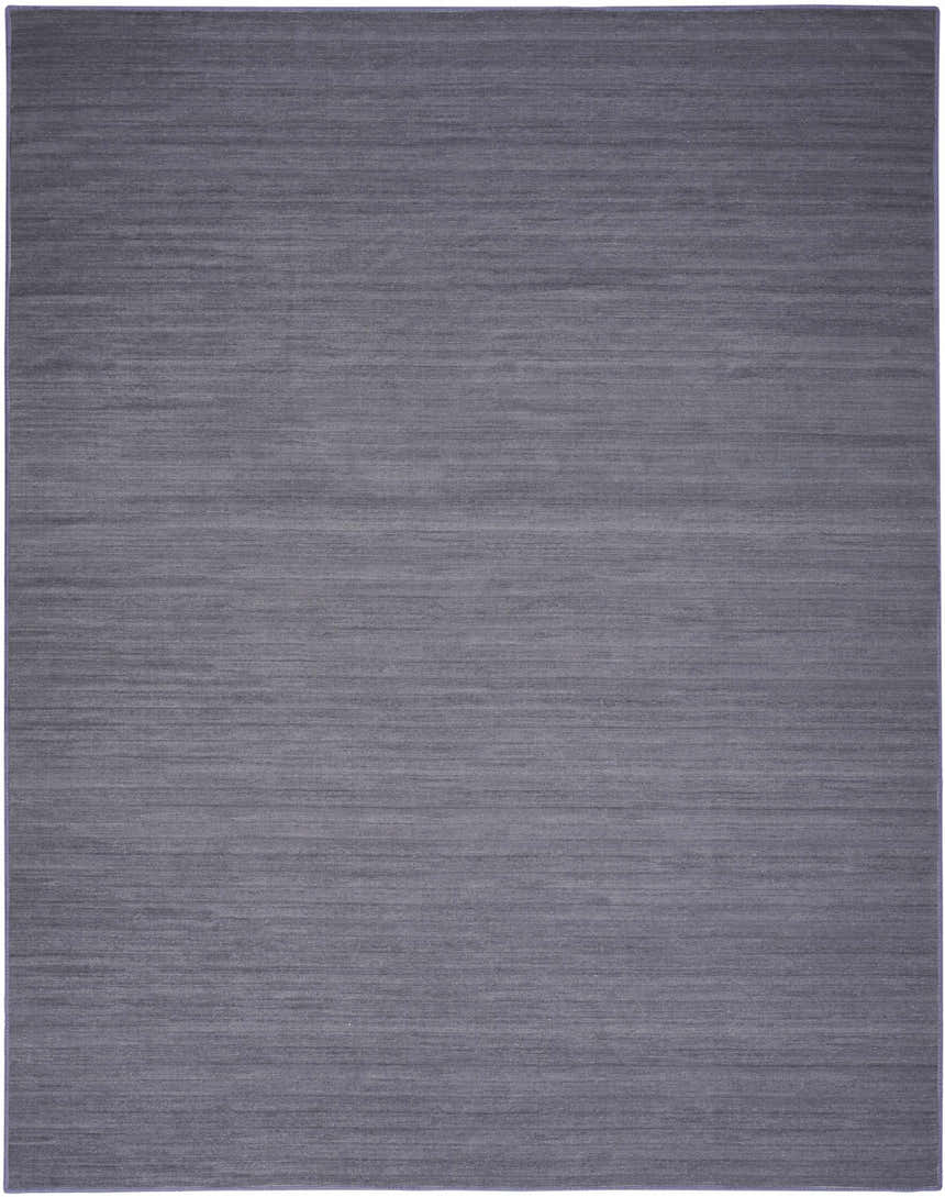 Close-up of the Nourison Essentials Navy Modern Indoor Washable Area Rug, showing its subtle texture and navy color.