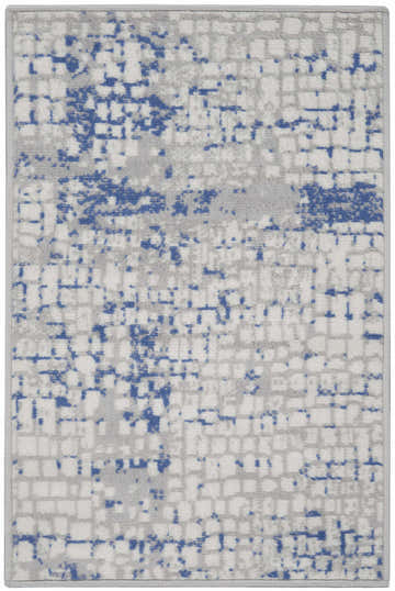 Close-up of the Nourison Whimsicle rug in grey and blue. Features a modern abstract pattern with a grid-like texture.