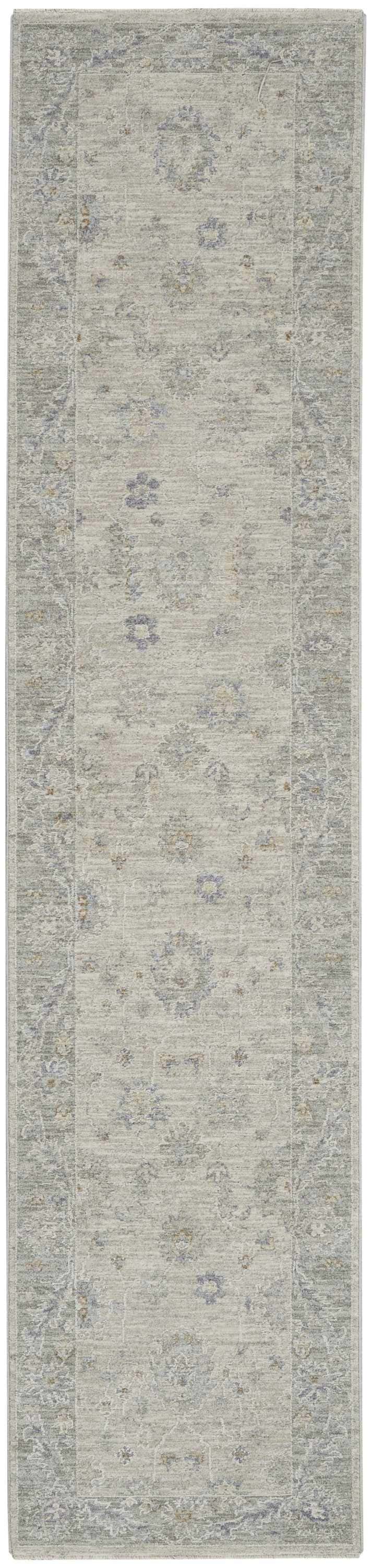 Close-up of the Nourison Infinite Light Grey Vintage runner rug, showing its floral pattern and soft, muted colors.