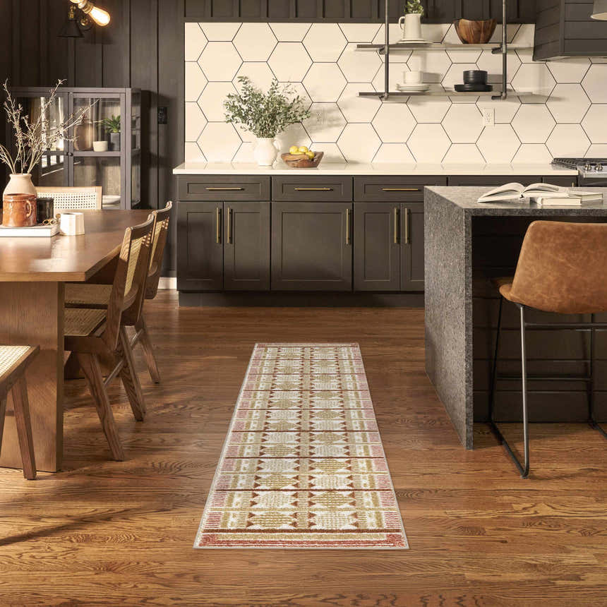 Modern kitchen and dining area with a Nourison Nordic Rust runner rug on hardwood floors.