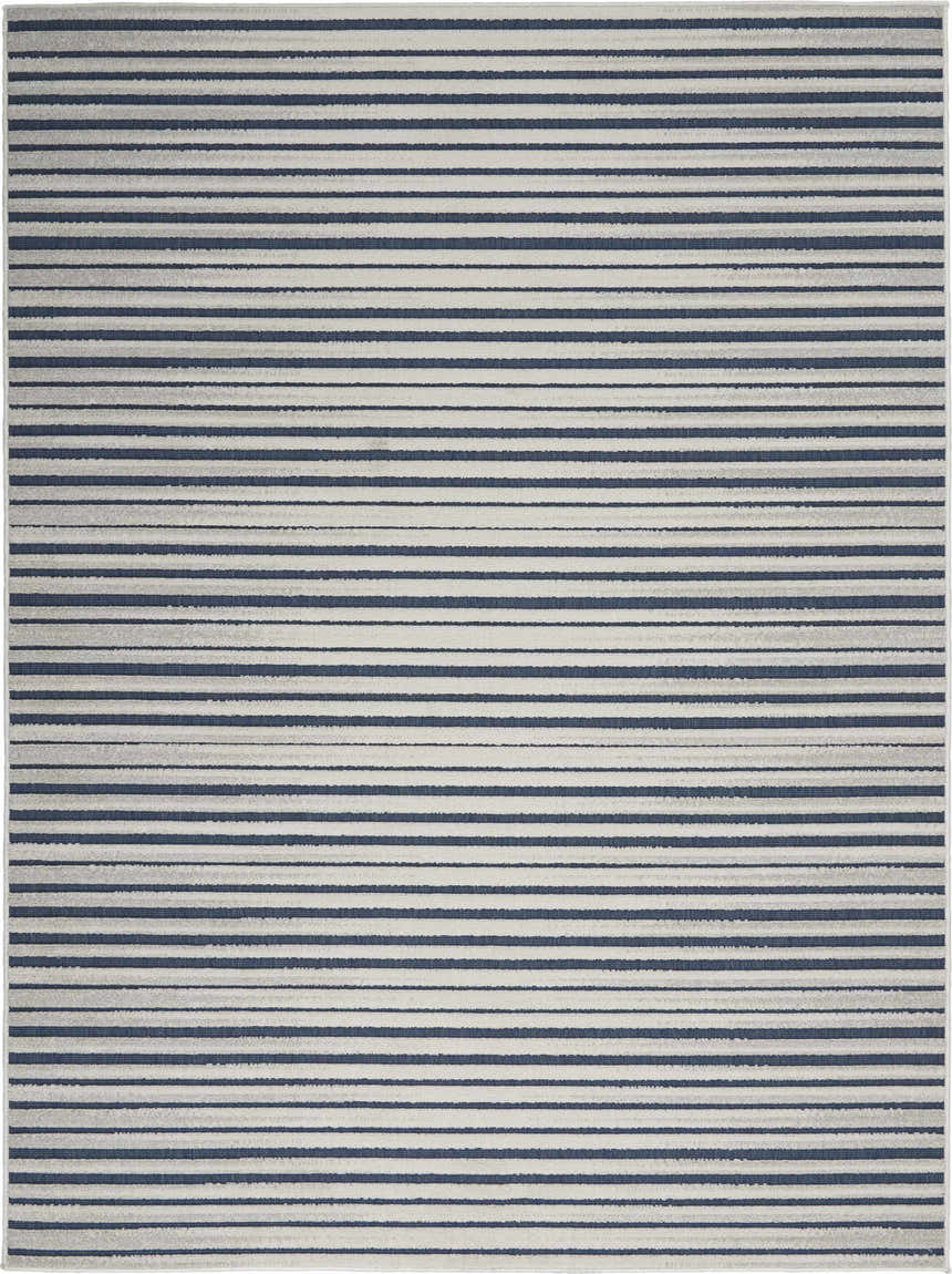 Close-up of the Nourison Key Largo Blue Contemporary Area Rug featuring a striped light blue and dark blue pattern.