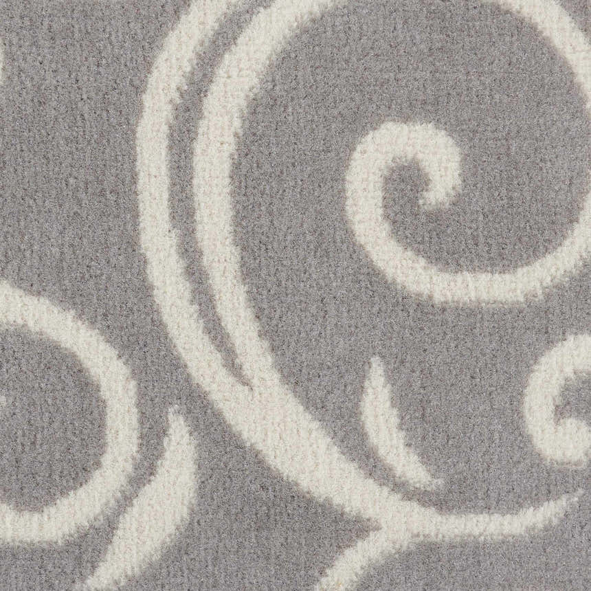 Close-up of the Nourison Grafix Grey Contemporary Indoor Area Rug, showing the gray and white swirling pattern.