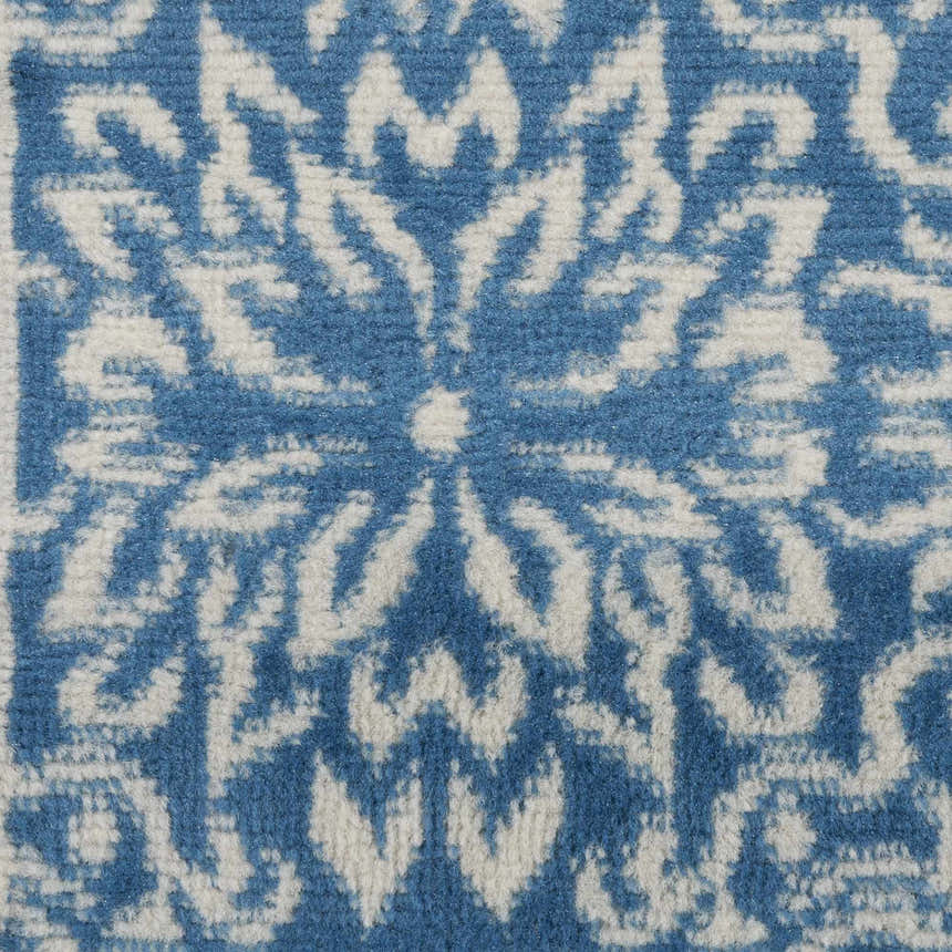 Close-up of Nourison Jubilant Ivory Blue Farmhouse Indoor Area Rug with a floral, medallion-style pattern.