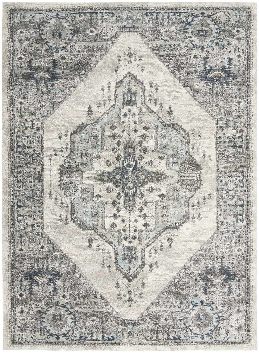 Close-up of the Nourison American Manor Grey Farmhouse Area Rug. Features a distressed gray, blue, and white traditional design.