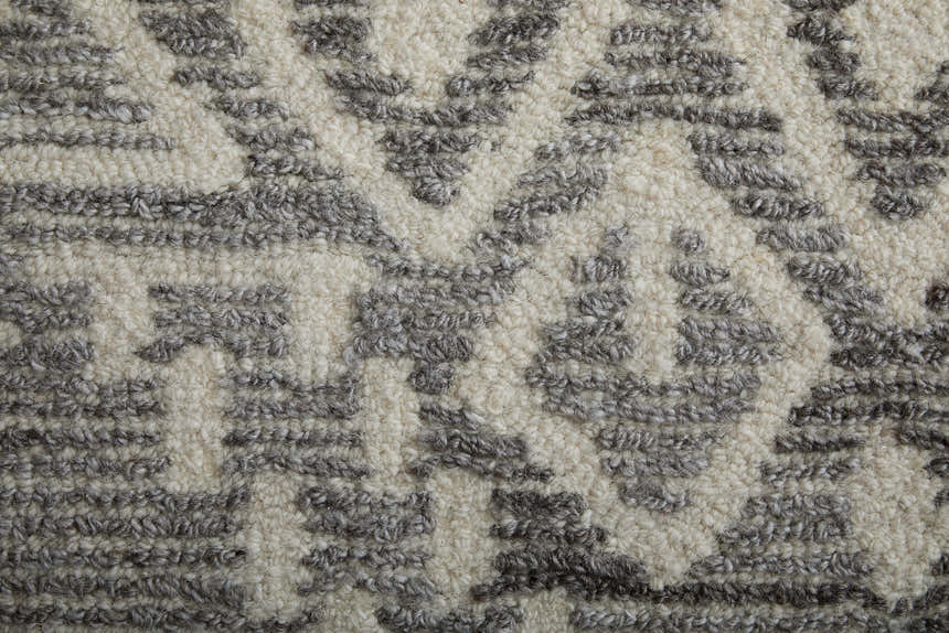 Close-up of the Feizy Asher Gray/White Area Rug showing its distressed transitional pattern and hand-tufted texture. Texture