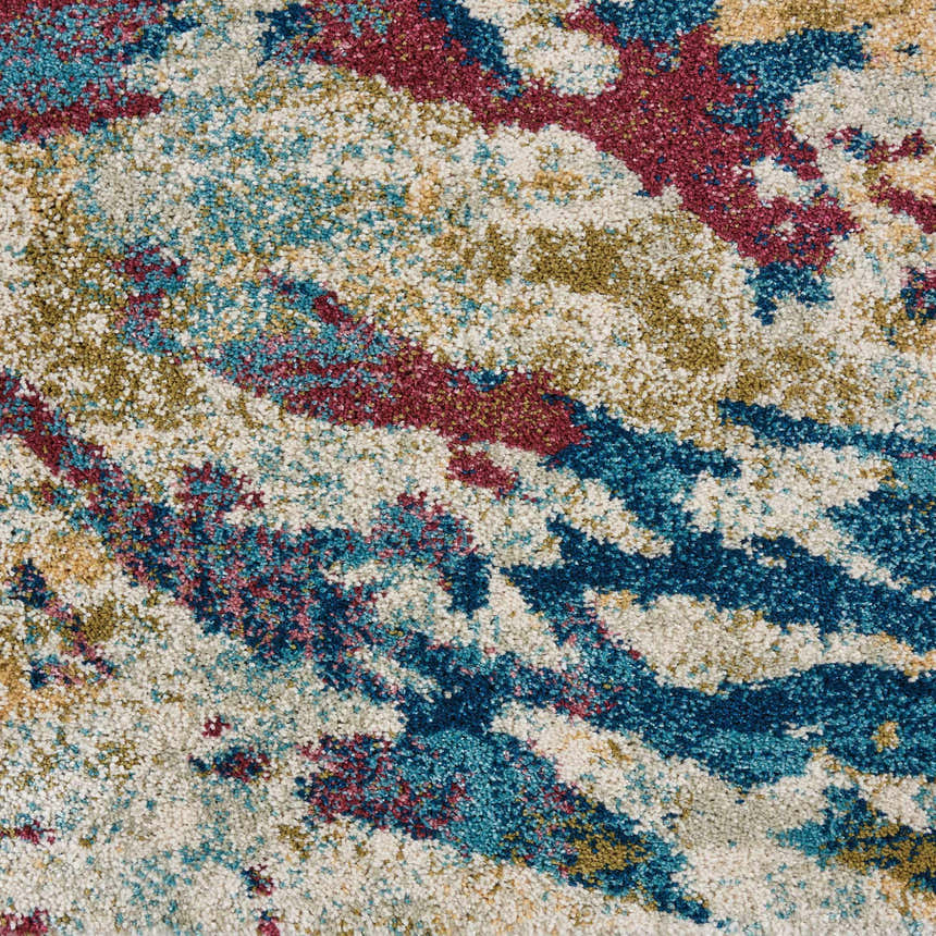 Close-up of Nourison Fusion Cream Multicolor rug showing abstract pattern and texture in cream, blue, red, and gold.