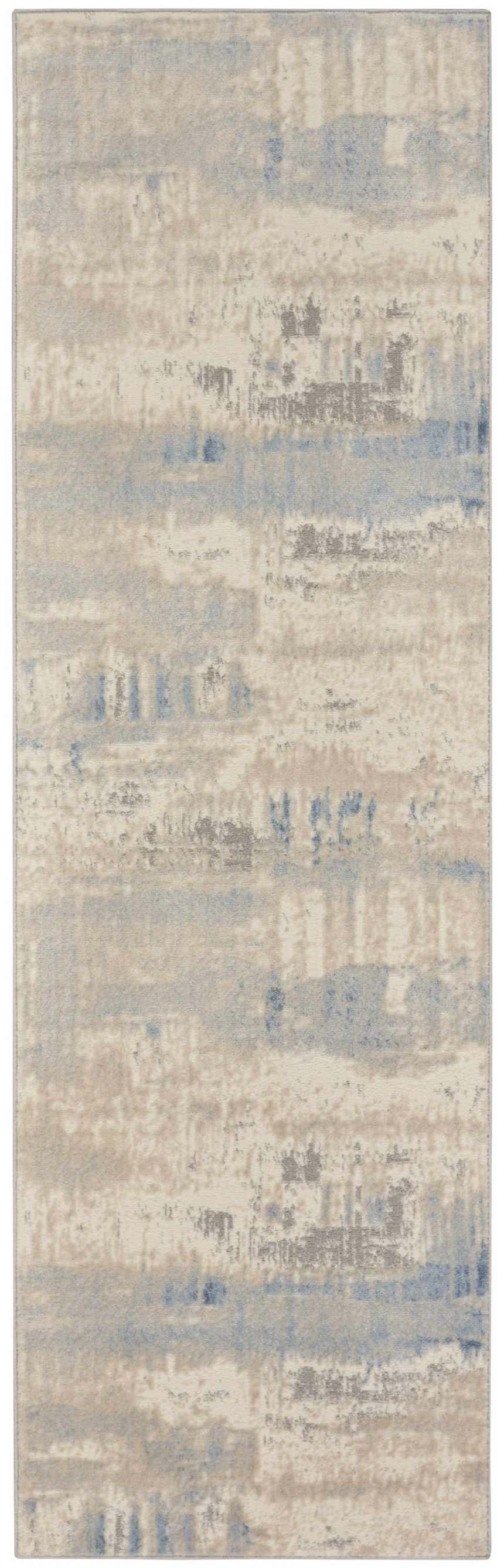Close-up of Nourison Solace Ivory Grey Blue Rug. High pile, machine-made rug with chestnut, blue, and grey abstract pattern.