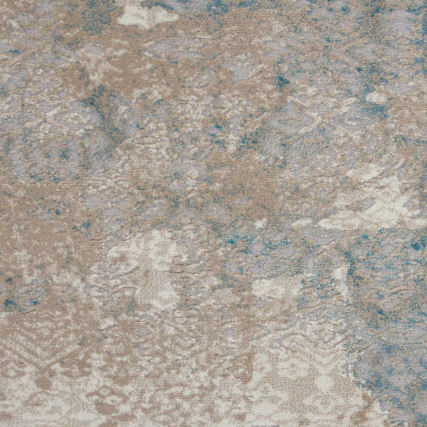 Close-up of Nourison Karma Ivory/Light Blue Vintage rug showing chestnut, ivory, and blue pattern and texture.