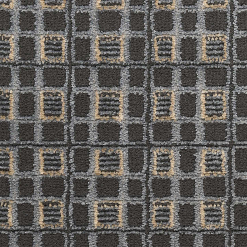 Close-up of the Nourison Nordic Black Taupe Art Deco Indoor Area Rug featuring a geometric ivory, black, and taupe pattern.