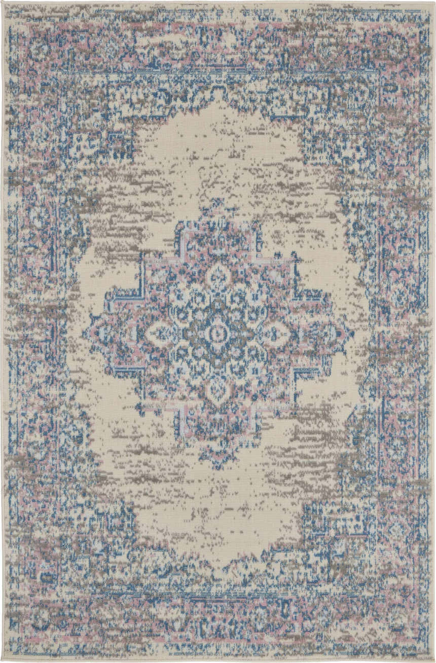 Close-up of the Nourison Grafix Ivory Pink Vintage Area Rug, featuring a distressed floral medallion pattern.