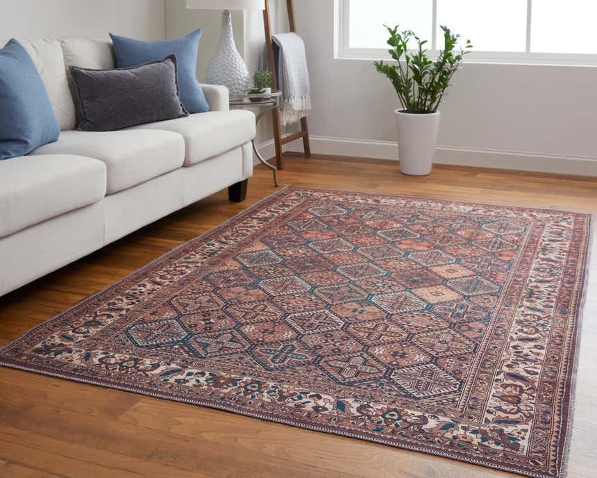 Living room with a Feizy Rawlins Brown/Red/Ivory rug, white sofa, wood floors, and natural light. Roomscene-Rectangle