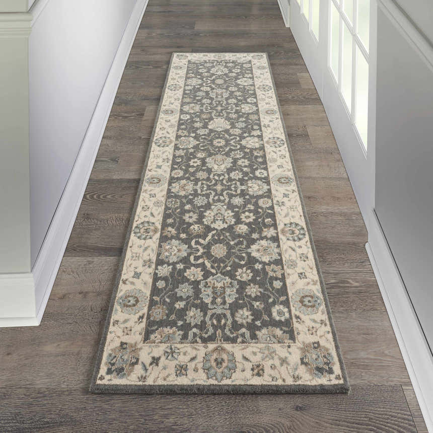 Hallway with Nourison Living Treasures Grey Ivory Farmhouse runner rug on dark wood floors, white trim and doors.