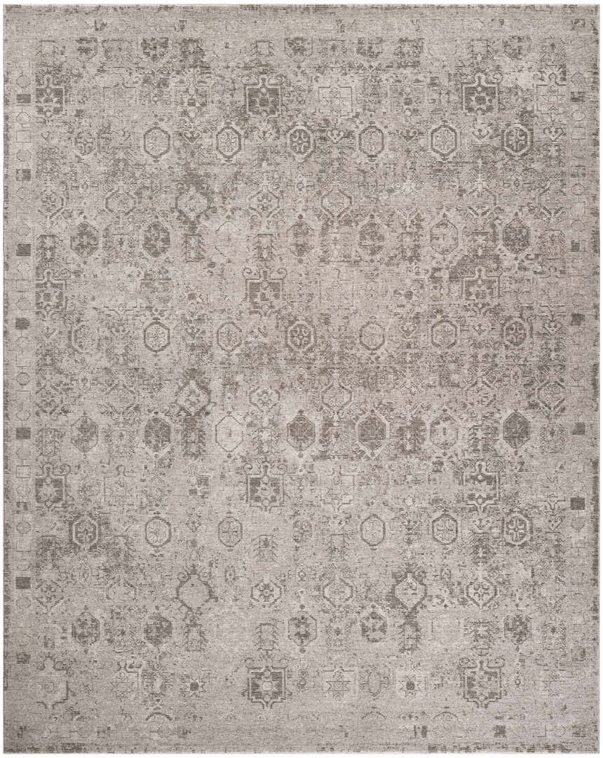 Close-up of the DKNY Pure Shades Grey Vintage Indoor Area Rug, featuring a distressed geometric pattern and soft gray tones.