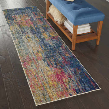 Hallway scene with Nourison Celestial Blue Yellow runner rug and blue bench on dark wood floor.
