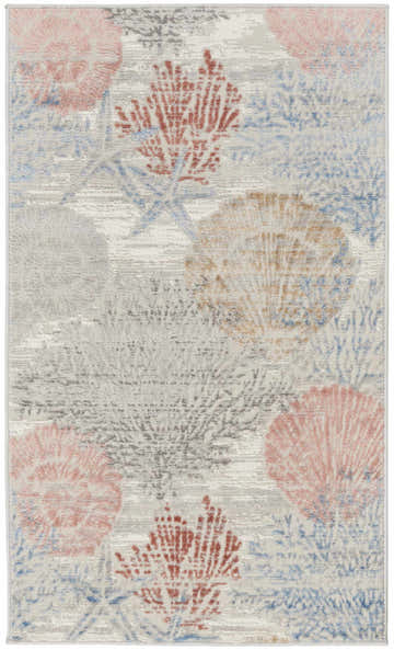 Close-up of Nourison Seaside Multicolor rug. Coastal style with coral, starfish, and seashell pattern in pink, red, blue, and gray.