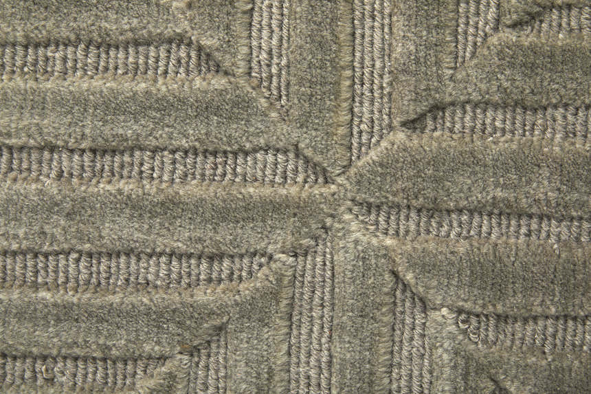 Close up of the textured, geometric pattern on the Feizy Channels Green/Taupe wool rug. Texture