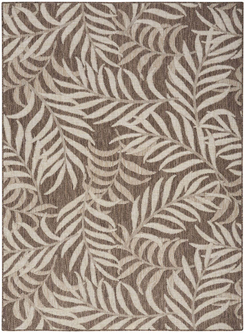 Close-up of the Nourison Garden Oasis Mocha Tropical Area Rug, featuring a light brown palm leaf pattern.
