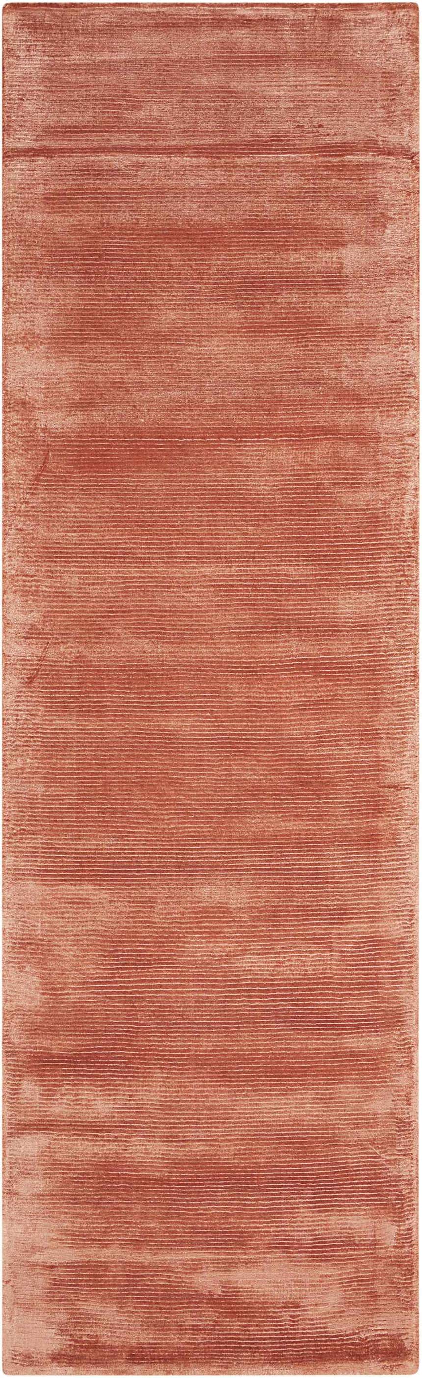 Close-up of the Calvin Klein Home Lunar Rust Indoor Area Rug, showing the textured horizontal pattern and rust color.