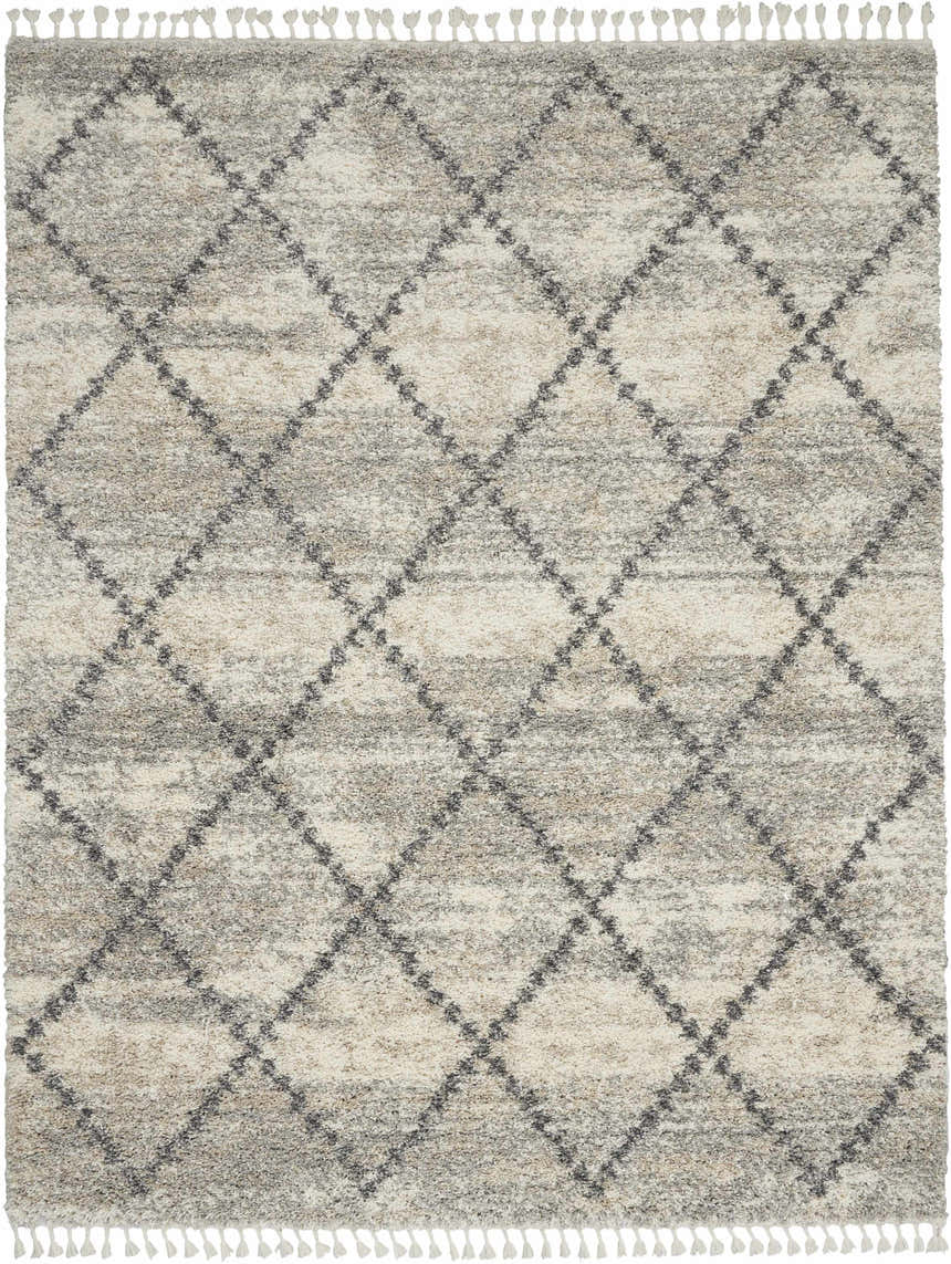 Close-up of the Nourison Oslo Shag rug. Ivory and grey shag rug with a diamond pattern and tassels.