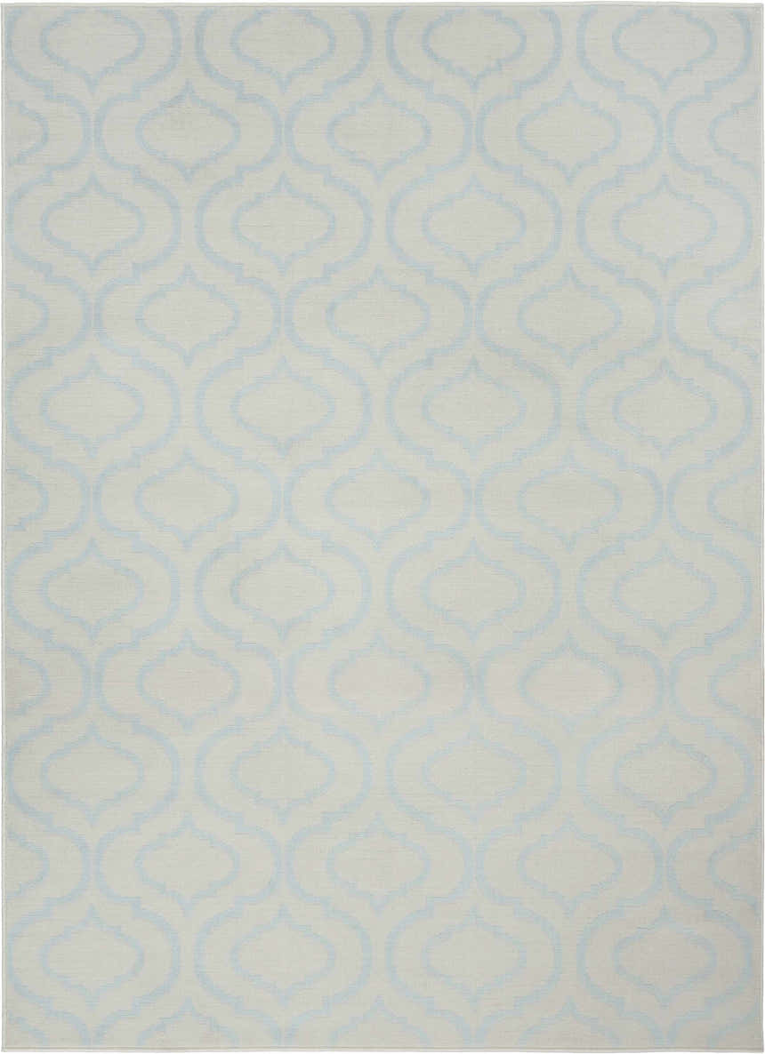 Close-up of Nourison Jubilant Ivory Blue rug, featuring a light blue quatrefoil pattern on an ivory background. Contemporary style.