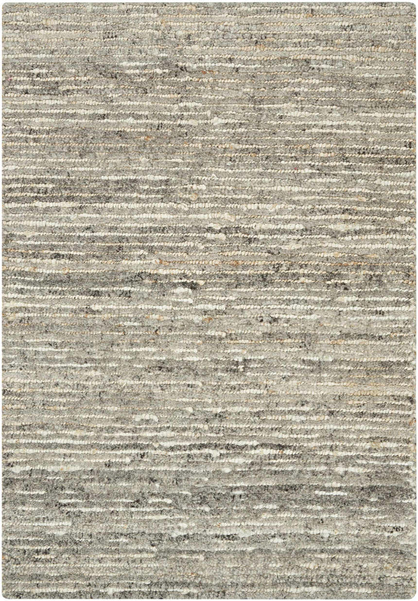 Close-up of the Calvin Klein Kathmandu Grey rug. Features a textured, horizontal stripe pattern in shades of gray, white, and beige.