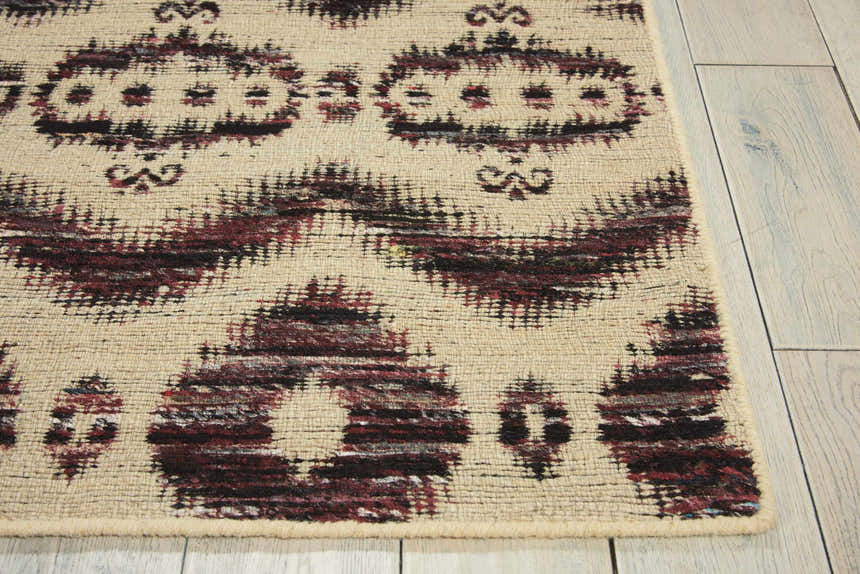 Close-up of Nourison Spectrum Beige Black rug showing abstract design, woven texture, and neutral tones.