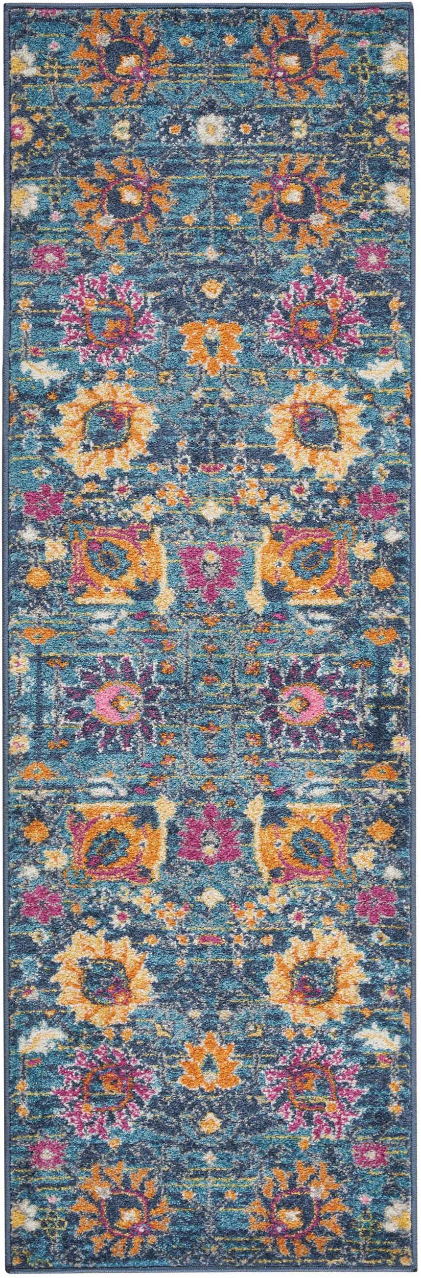 Close-up of Nourison Passion Denim Bohemian rug. Features a floral pattern in denim blue, orange, and pink hues.
