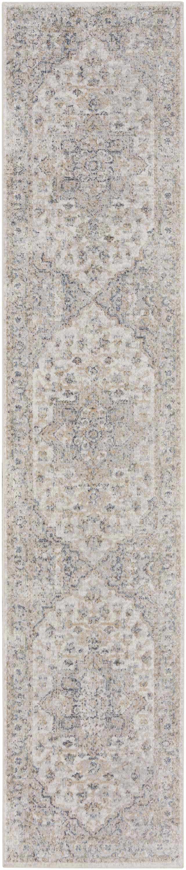 Close-up of the Nourison Astra Silver Grey Vintage Rug. Machine-made with a distressed, ornate pattern.
