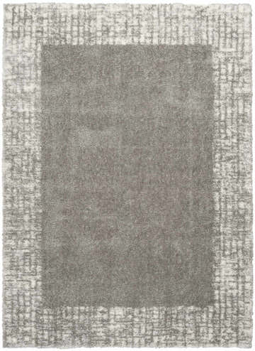 Close-up of the grey Nourison Pacific Shag rug, showing the soft texture and subtle geometric border pattern.
