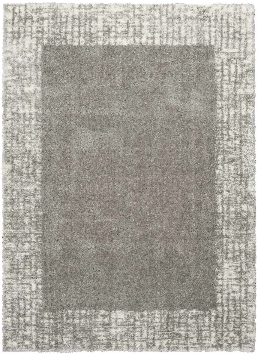 Close-up of the grey Nourison Pacific Shag rug, showing the soft texture and subtle geometric border pattern.