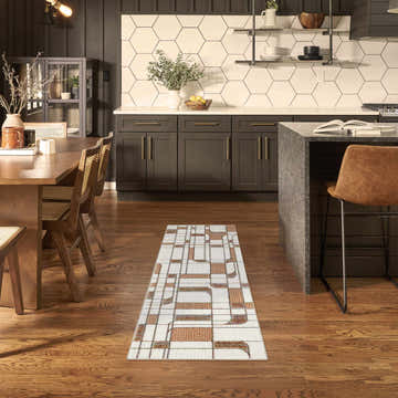Modern kitchen and dining area with Nourison Nordic Ivory Rust runner rug.