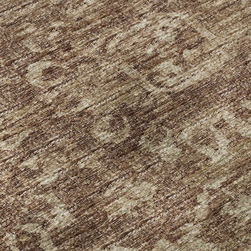 Close-up of the Dalyn Aberdeen AB1 Mink rug. The rug has a traditional pattern in mink, taupe, and shades of brown.