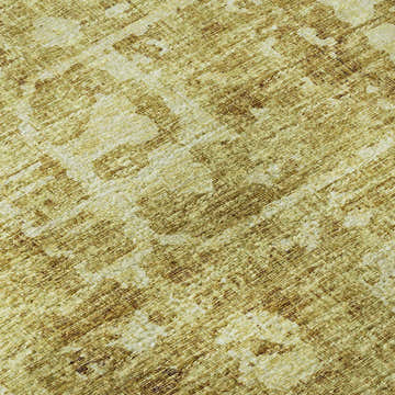 Close-up of the Dalyn Aberdeen AB2 Gold Washable Area Rug. Features a textured, abstract pattern in gold, taupe, and shades of gold.