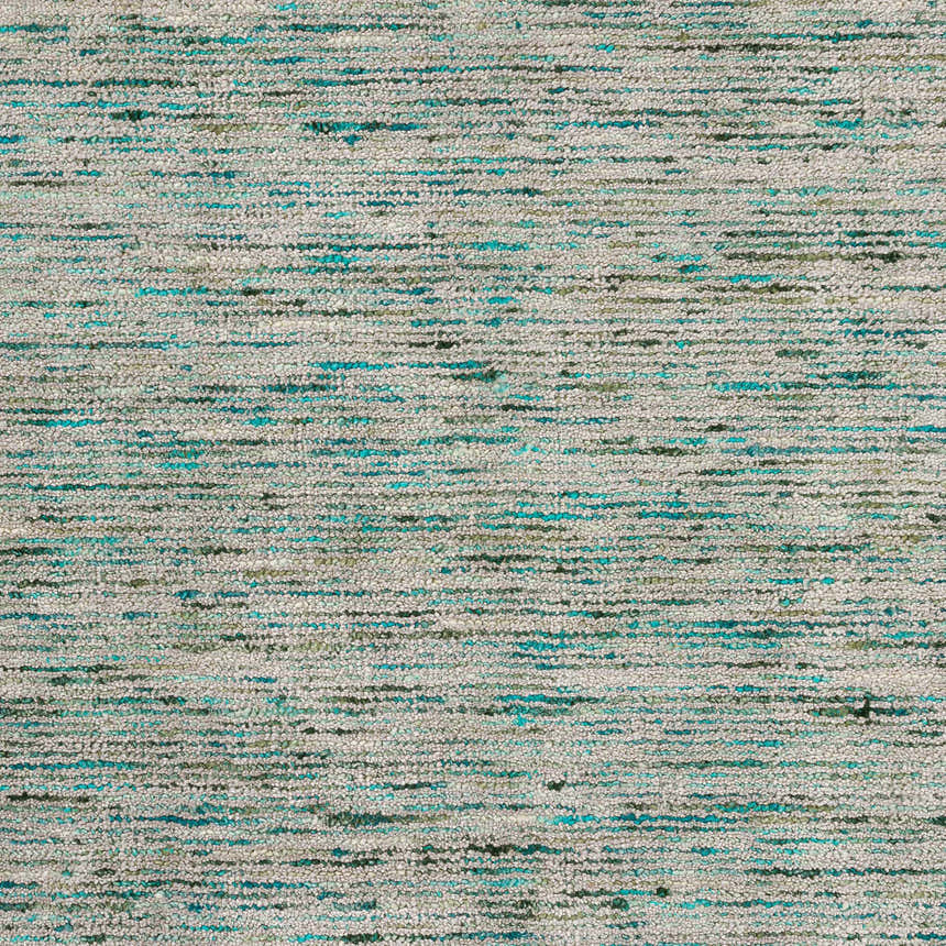 Close-up of Dalyn Arcata AC1 Aruba Area Rug. Hand-loomed wool and viscose rug with aqua, aruba, chestnut, olive, putty, and teal.