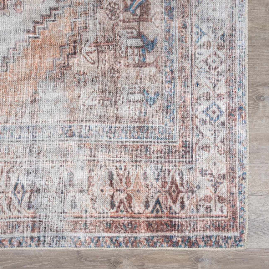 Close-up of the Arncliffe Washable Area Rug. Features an oriental design in brown, orange, ivory, and light blue tones. Swatch