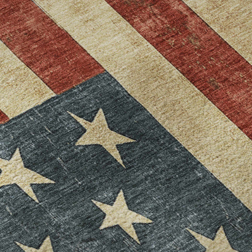 Close-up of the Americana AM1 Red Washable Area Rug. Features a distressed American flag design with beige stars and red stripes.